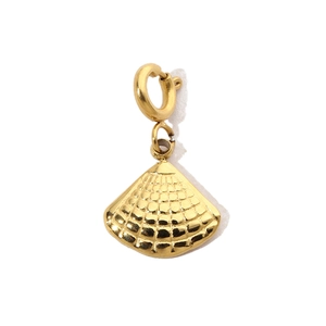 Detailed view of a gold shell-shaped pendant with a refined textured metallic finish