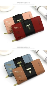 Detail of multi-color paneled leather wallets with hollow leaf patterns and metal pendants