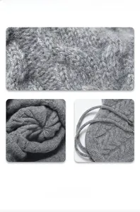Detail of grey cable knit texture with thick wool fabric and drawstring with metal tips