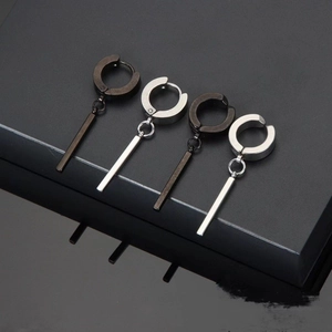 Detail of four stainless steel hoop earrings with rectangle pendants in black and silver