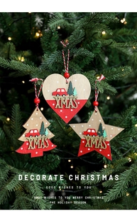 Detail of wooden heart, tree, and star Christmas ornaments with red and white polka dots