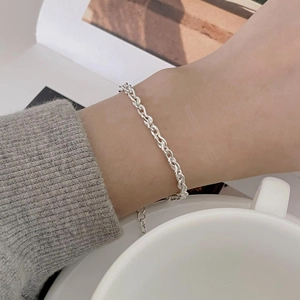 Minimalist 925 sterling silver geometric chain bracelet worn on wrist in a lifestyle setting