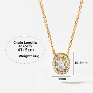 Macro detail of gold-plated necklace with oval pendant featuring pavé-set crystals