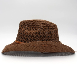 Deep brown hollow-out straw cowboy hat with wide brim and decorative string tie