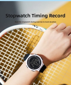 Close-up of waterproof digital sports watch showing date and stopwatch on wrist