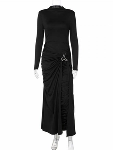 Detail of elegant black maxi dress featuring waist ruching and a silver metal buckle accent