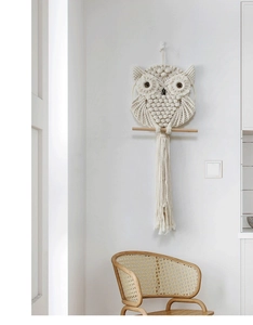 Detailed Macramé knotting technique on handmade bohemian owl wall hanging
