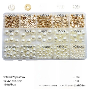 Detail of 770pcs DIY jewelry kit with gold spacer beads and white ABS pearls in a storage box