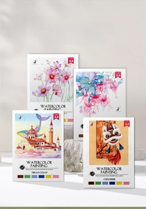 Close-up of portable watercolor cards with built-in paint palettes and floral designs