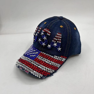 Close-up of sparkling USA rhinestones and American flag patterns on denim baseball cap