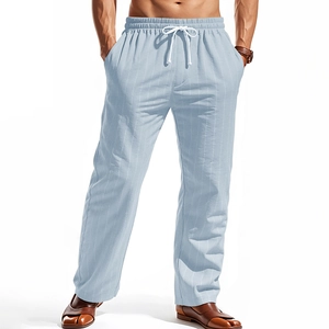 Detail of light blue vertical striped linen trousers with adjustable drawstring waistband