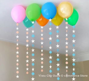 Colorful balloons with hanging star and circle paper garlands for birthday party decoration