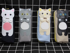 Detail of cute cat canvas pencil cases showing four colors with yellow zipper and cat ears