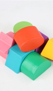 Macro shot of colorful geometric solid wood blocks with safe water-based paint finish