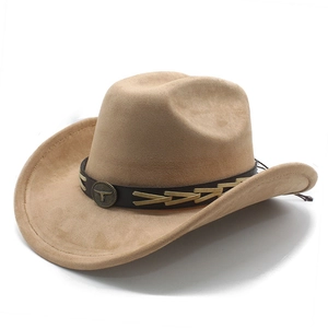 Detail of tan suede cowboy hat featuring a leather band and a vintage metal bull head