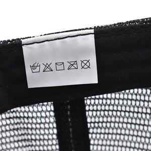 Detail of 100% cotton wash label and breathable mesh texture on the baseball cap