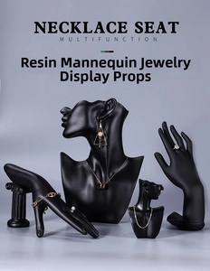 Detailed set of matte black resin mannequin busts and hand models for jewelry display