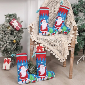 Set of four blue Christmas stockings with Santa Claus and holiday scene patterns