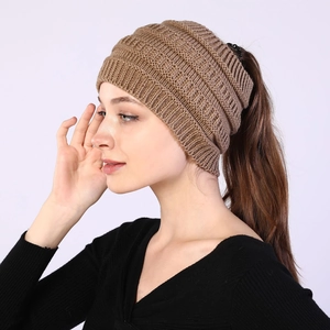 Side view of brown knitted ponytail beanie headband for women showing thick wool texture