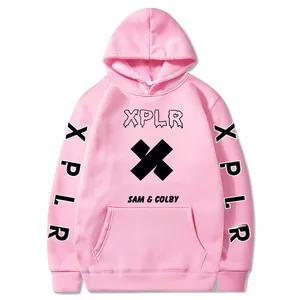 Detailed view of pink XPLR Sam & Colby hoodie featuring black logo print and front pocket