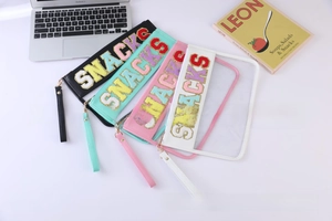 Group of colorful PVC snack bags with sequin embroidery and detachable wrist straps