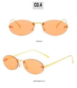 Close-up of frameless oval sunglasses with orange lenses and golden metal temples