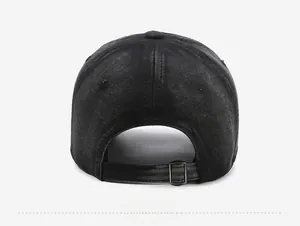 Detail view of the washed black denim baseball cap with an adjustable metal strap buckle