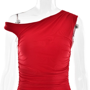 Detail of red one-shoulder dress showing elegant side slit and ruched waist design