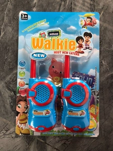 Detail view of colorful two-pack walkie talkie toy set for children in retail packaging