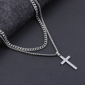 Detail of double-layer stainless steel Cuban chain and box chain with cross pendant