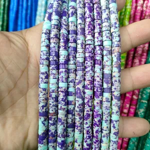 Macro shot of 3x6mm cylindrical natural stone spacer beads with blue and purple textures