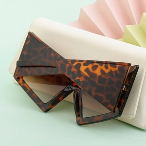 Detail of oversized leopard cat eye sunglasses frame with premium thick acetate texture