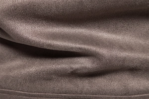Detailed macro shot of premium faux suede fabric texture and reinforced hem stitching