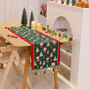 Christmas chenille table runner featuring Santa Claus prints and festive green tassels