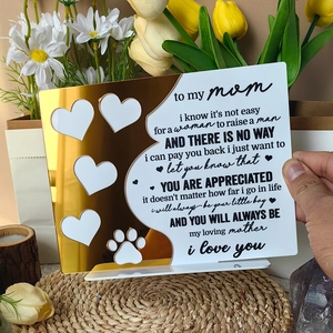 Close-up of acrylic plaque with gold mirror heart design and emotional tribute to mom