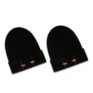Black knit beanie with embroidered creepy eye design for men and women street style