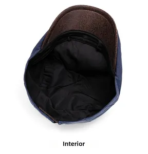 Detailed view of dark blue cotton linen hat with brown brim and black fabric lining