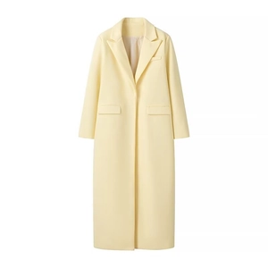 Elegant long pale yellow wool coat with notch lapels and a minimalist tailored fit