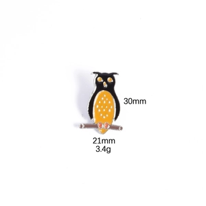 Detail view of owl enamel pin with 30mm height and 21mm width measurements