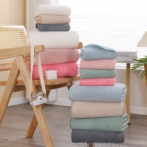 Thick coral fleece towels in multiple colors with waffle texture for home and spa use