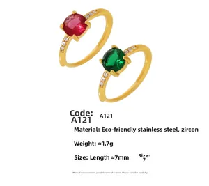 Detailed macro view of 3ct red and green zircon rings with pavé stones in gold plating