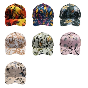 Set of seven tropical print baseball caps featuring vibrant floral and leaf patterns