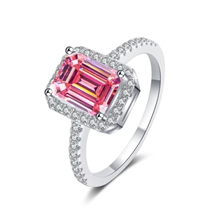 Detail of emerald-cut pink-orange moissanite ring in S925 sterling silver setting