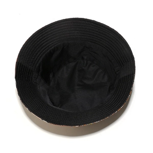 Close-up of bohemian bucket hat showing the black inner lining and colorful geometric prints