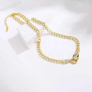 18K gold plated snake head necklace with cubic zirconia on a minimalist Cuban chain