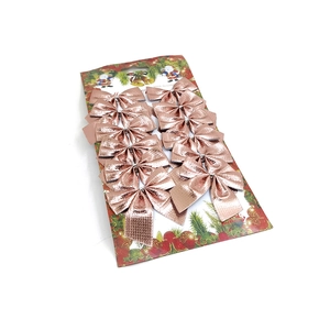 Detail of 12 rose gold metallic Christmas bows with fine embossed texture on display card