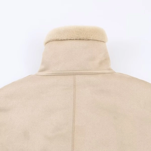 Detail of light beige jacket collar featuring soft faux fur lining and suede texture