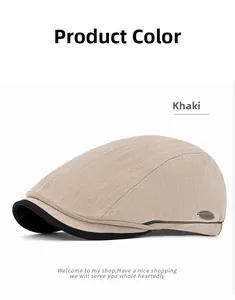 Detail of khaki herringbone newsboy cap featuring black brim and metal side logo