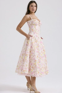 Detail of pink floral midi dress with delicate lace hemline and slim fit waist