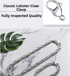Detail of silver Byzantine chain with heavy-duty lobster clasp on marble background